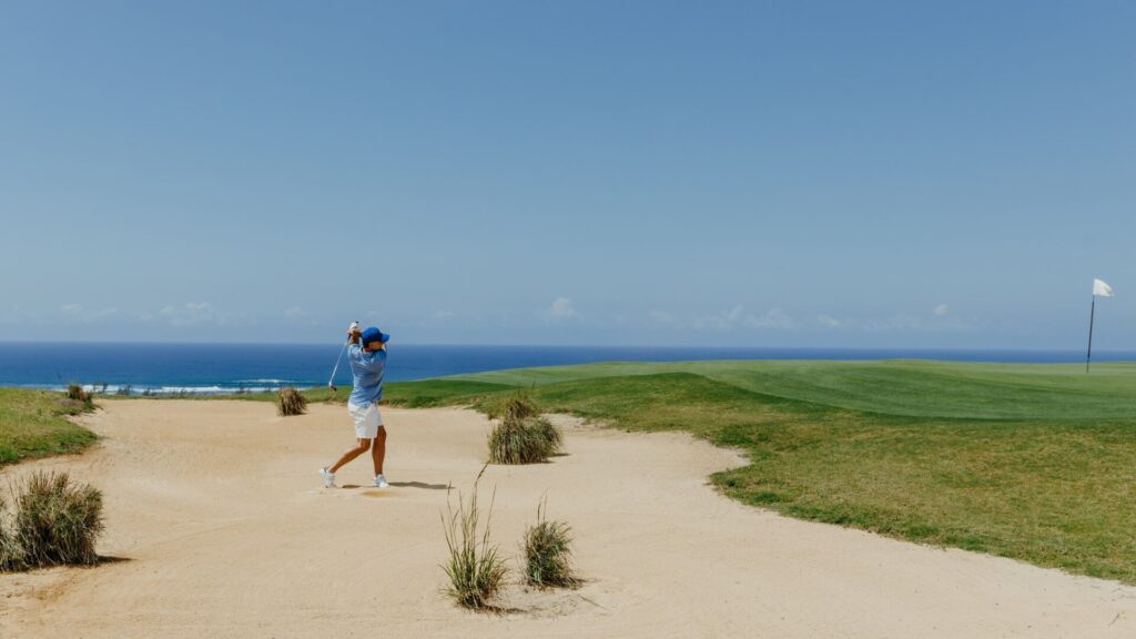 golfer playing on the world- class golf course heritage golf club mauritius