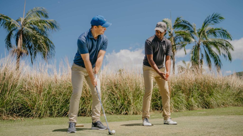 man learning golf for a perfecr balanced escape at the Heritage Golf Club Mauritius